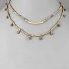 GOLDEN STELLA CURVED BAR BEAD LAYER NECKLACE