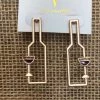 GOLDEN STELLA WINE GLASS SHADOW BOTTLE EARRINGS